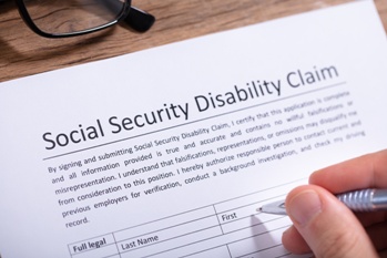 Social Security Disability Claim Paperwork and Pen
